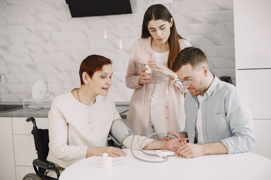 A family member assists a senior in a wheelchair with a blood pressure check, symbolizing care and wellbeing.