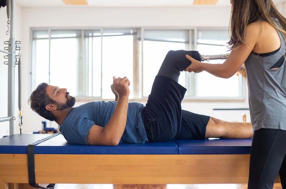 Man and woman engaging in a physical therapy session, focusing on prosthetic leg recovery and rehabilitation.